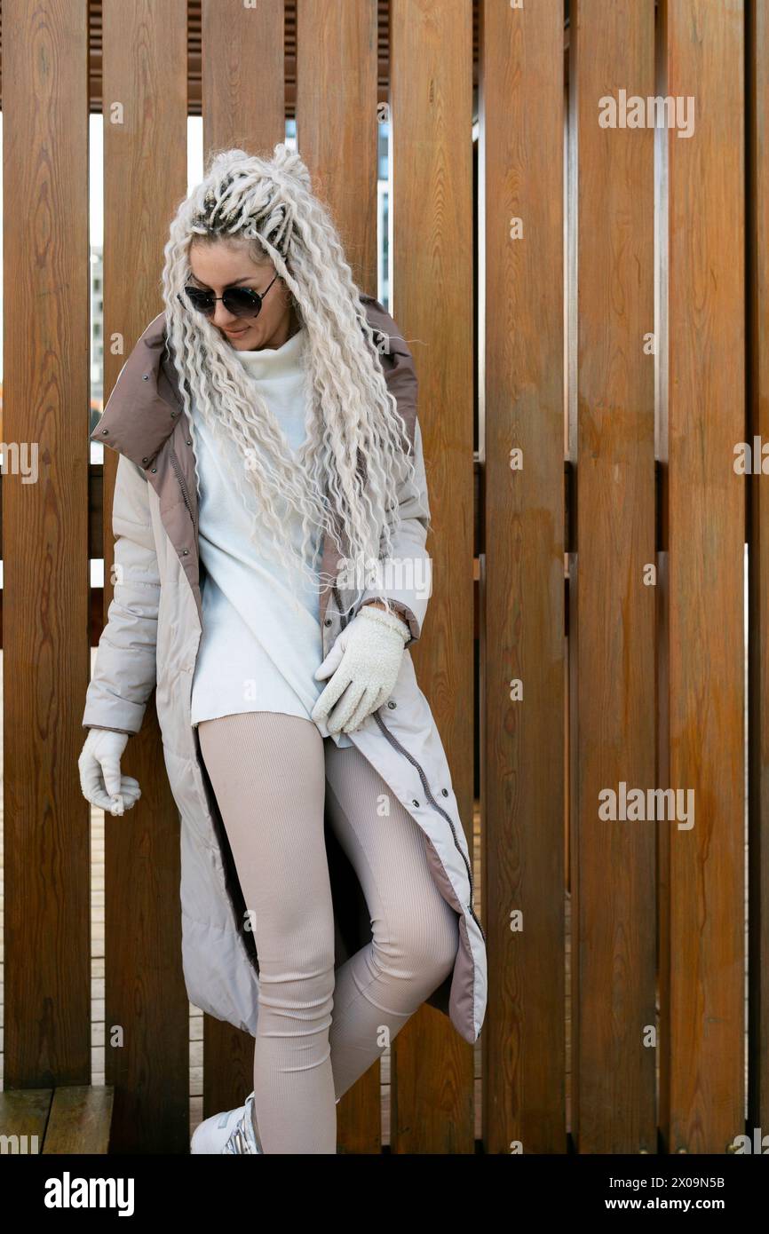 Woman With Long White Hair Wearing Fur Coat Stock Photo - Alamy