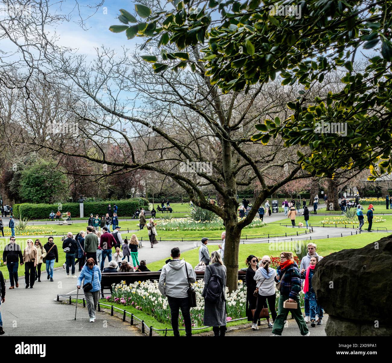 Crowds enjoying the Spring sunshine  in St Stephens Green, Dublin, Ireland. Stock Photo