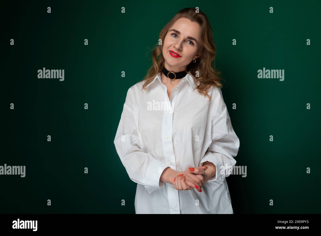 Woman in White Shirt Posing for Picture Stock Photo - Alamy