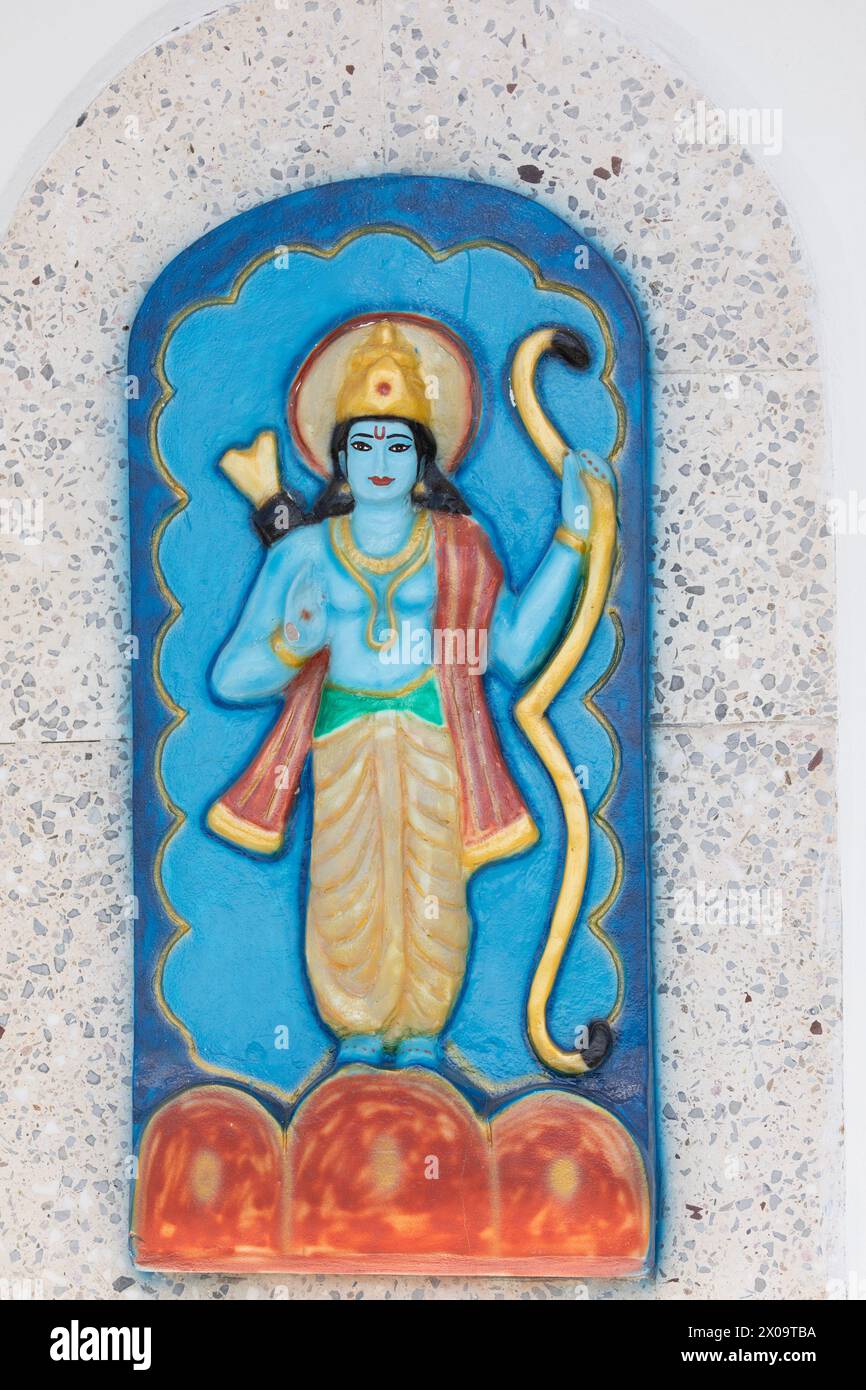 Murti of the Hindu deity Rama, with his bow and quiver of arrows, on an exterior wall of the Temple in the Sea at Waterloo, Carapichaima, Trinidad. Stock Photo