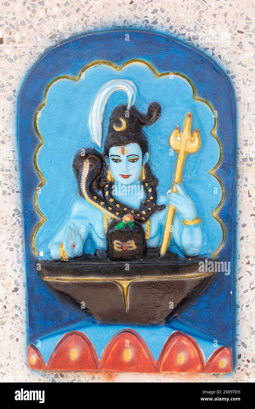 Murti of the Hindu deity Shiva, on an exterior wall of the Temple in the Sea at Waterloo, Carapichaima, Trinidad. Stock Photo