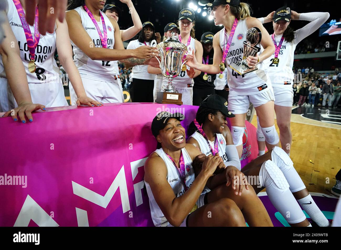 London Lions team celebrate with the trophy after victory in the EuroCup Women's Final second leg match at the Copperbox Arena, London. Picture date: Wednesday April 10, 2024. See PA story BASKETBALL London. Photo credit should read: Zac Goodwin/PA Wire. RESTRICTIONS: Use subject to restrictions. Editorial use only, no commercial use without prior consent from rights holder. Stock Photo