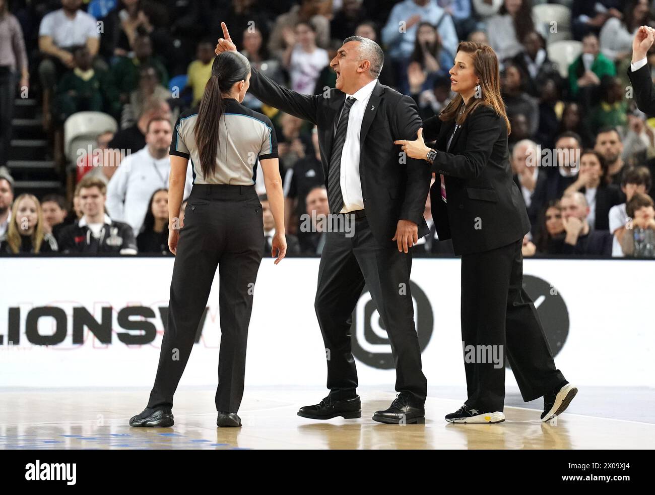 Besiktas coach Aziz Akkaya (centre) reacts after being sent off by the ...
