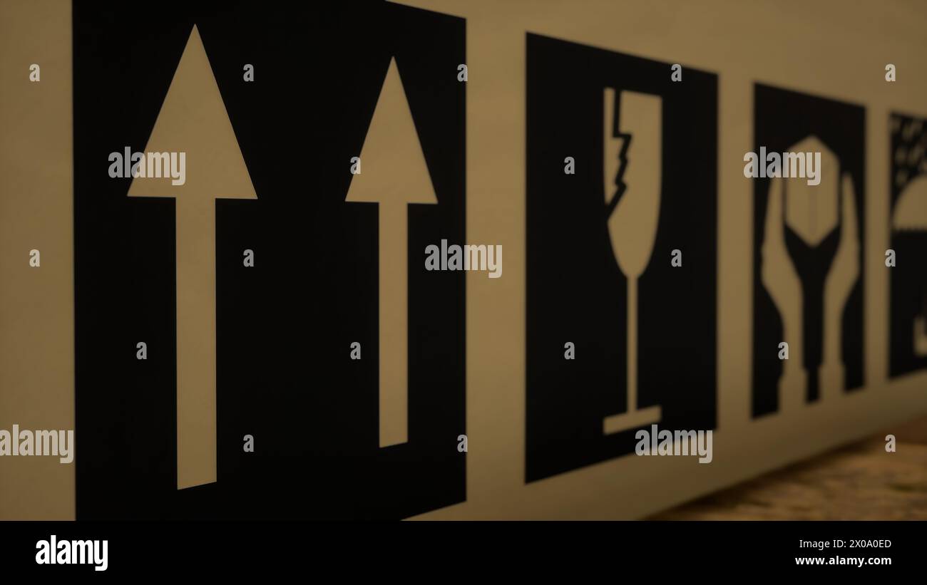 Caution labels on cardboard boxes stored in storage facility, tags and ...