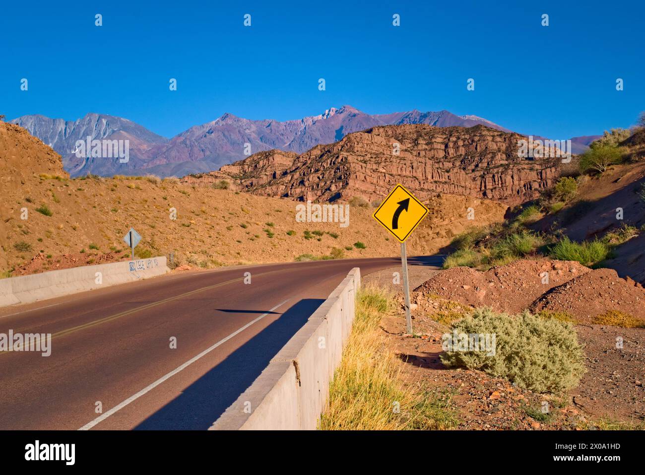Yellow bend in the road sign hi-res stock photography and images - Alamy