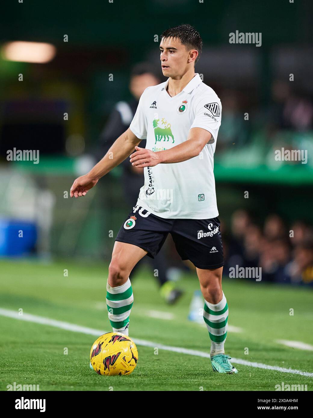 Mario Garcia – Sr. Cisne Mario Garcia of Real Racing Club compete for the ball with