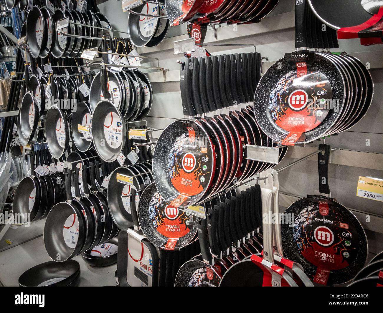 picture of pans for sale in a supermarket of belgrade, serbia, mainly teflon an non stick pans and skillets. Stock Photo