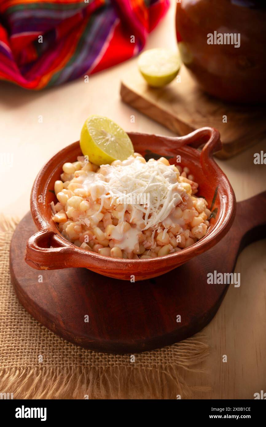 Esquites. Corn kernels cooked and served with mayo, sour cream, lemon