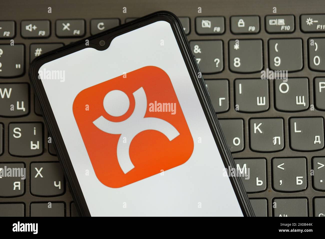 KYIV, UKRAINE - APRIL 1, 2024 Dianping platform icon on smartphone screen on black keyboard close up. iPhone display with app logo on dark keypad buttons Stock Photo