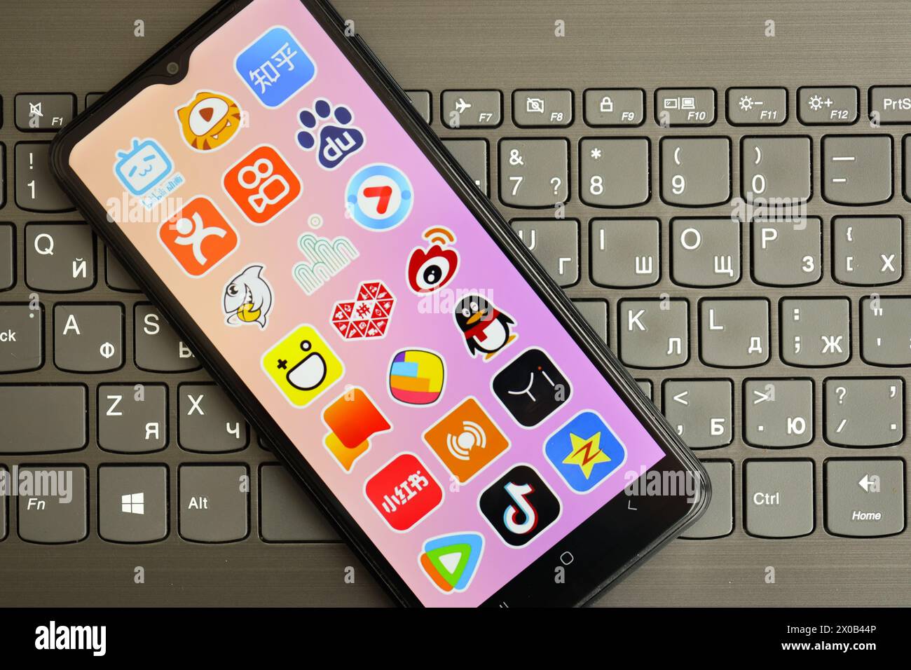 KYIV, UKRAINE - APRIL 1, 2024 Asian apps icon on smartphone screen on ...