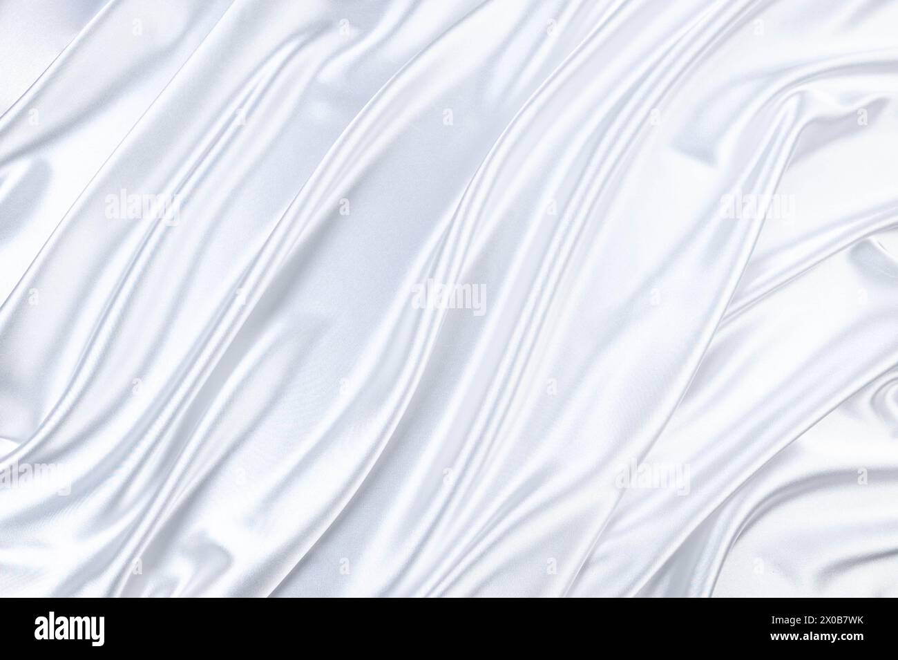 Luxury white satin background. Soft and elegant silk fabric. Flowing ...