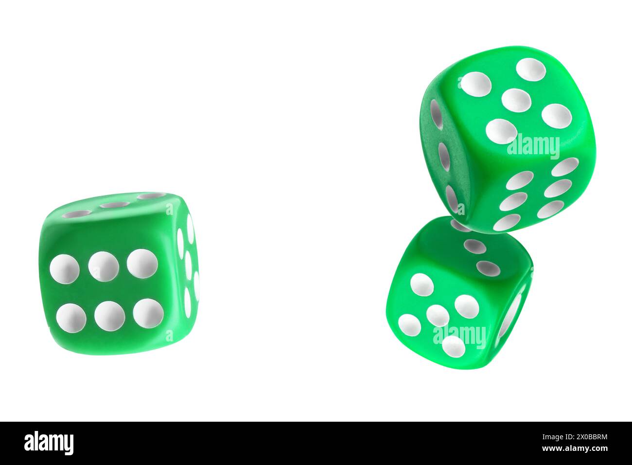 Three green dice in air on white background Stock Photo