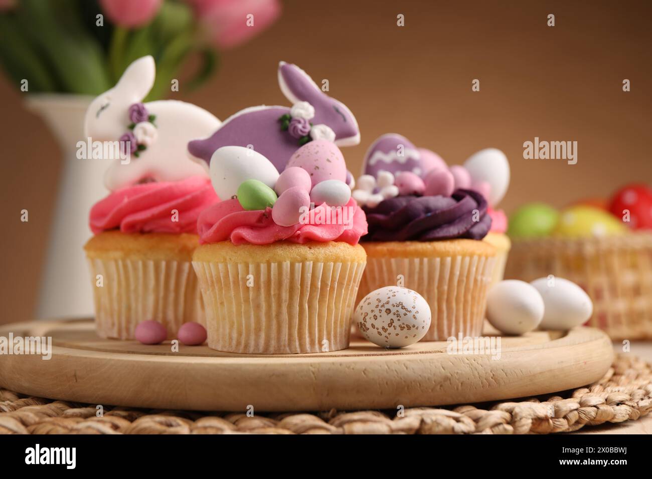 Tasty cupcakes with Easter decor on table Stock Photo