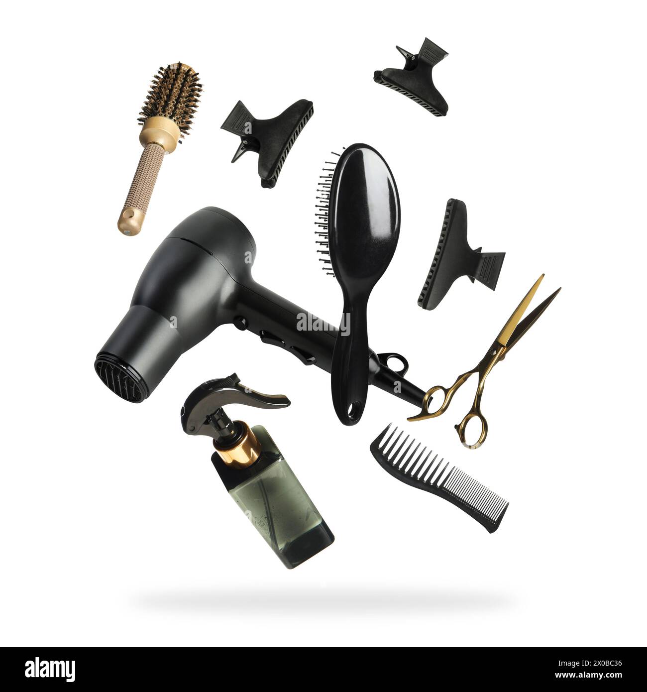 Professional hairdresser tools falling on white background Stock Photo ...