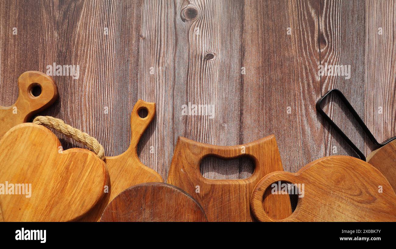 Empty cutting boards on wooden background . Stock Photo