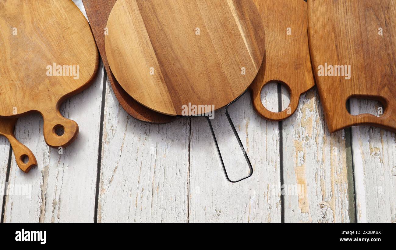 Empty cutting boards on wooden background . Stock Photo