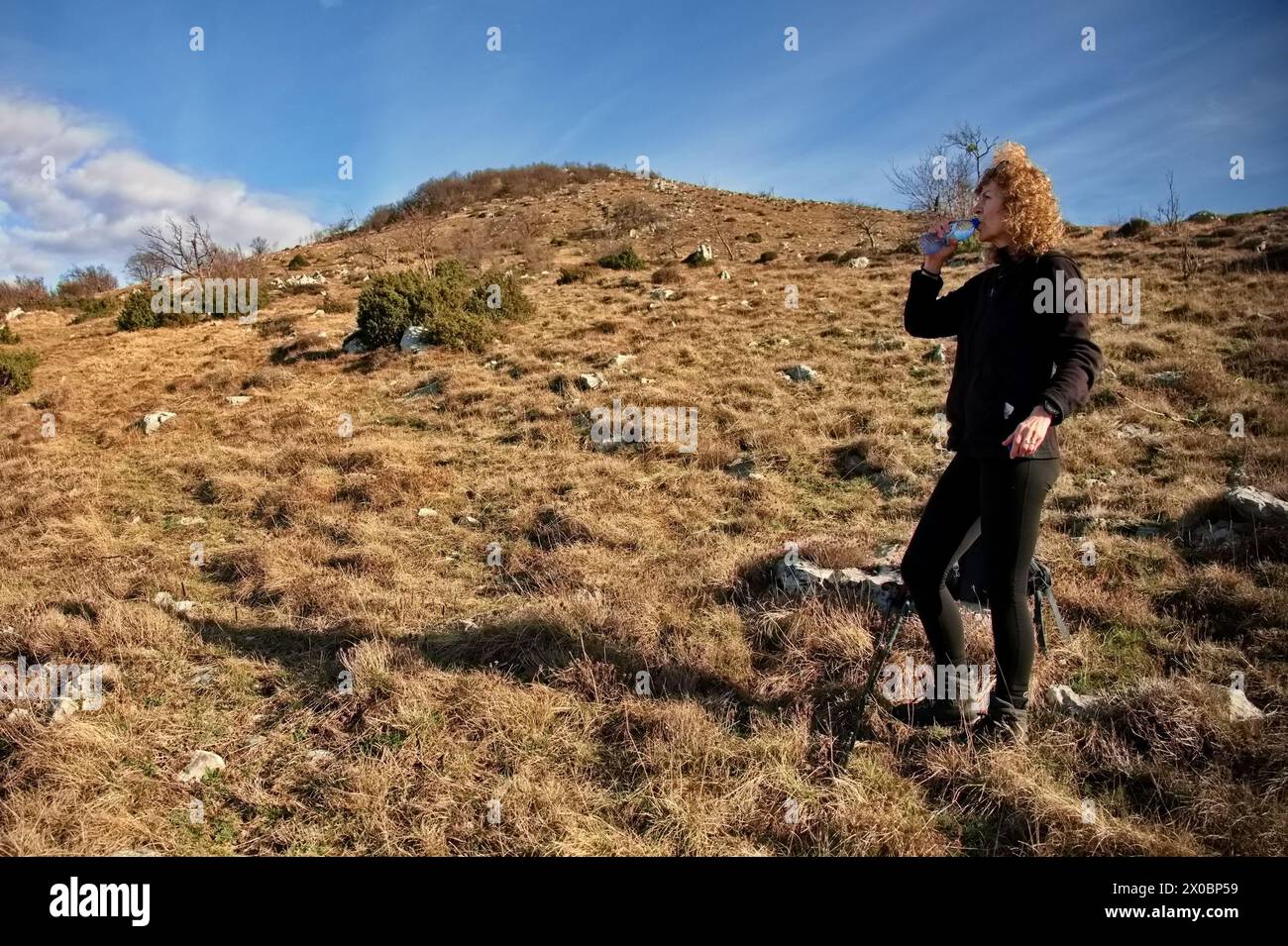 Woman mountain bright sky blue hi-res stock photography and images - Alamy