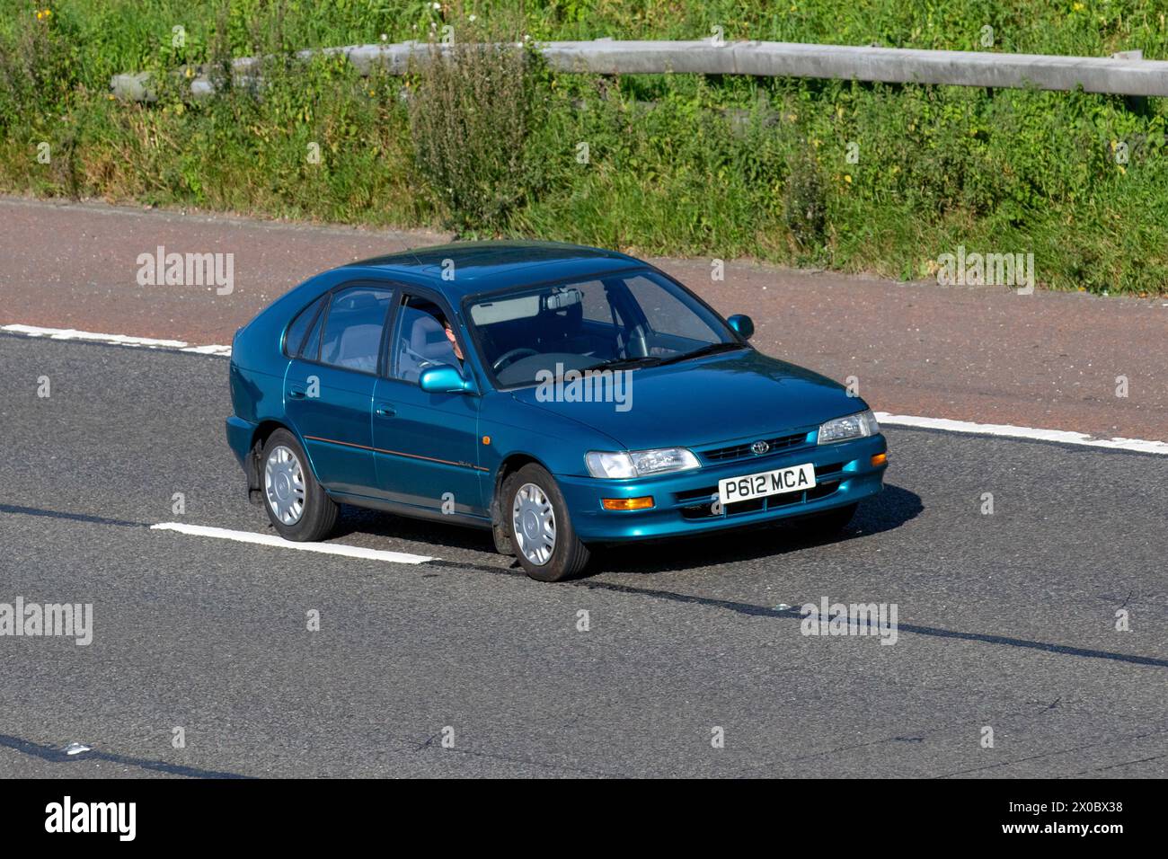 1996 90s nineties Blue Toyota Corolla Solair SE motoring in Manchester M6 UK Stock Photo
