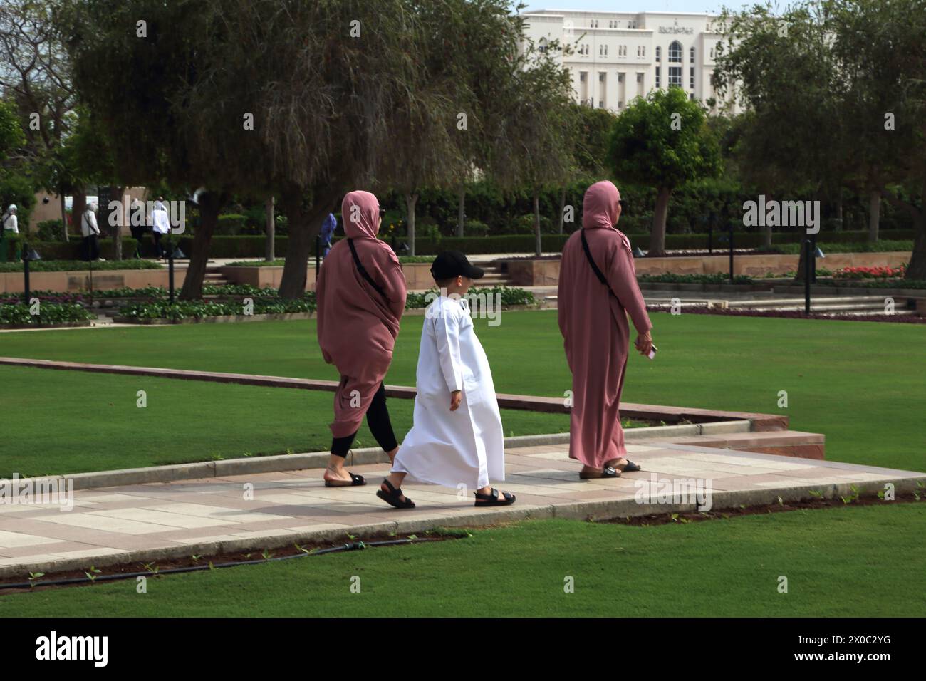 Sultan Qaboos Grand Mosque Visitors in the Gardens Muscat Oman Stock Photo