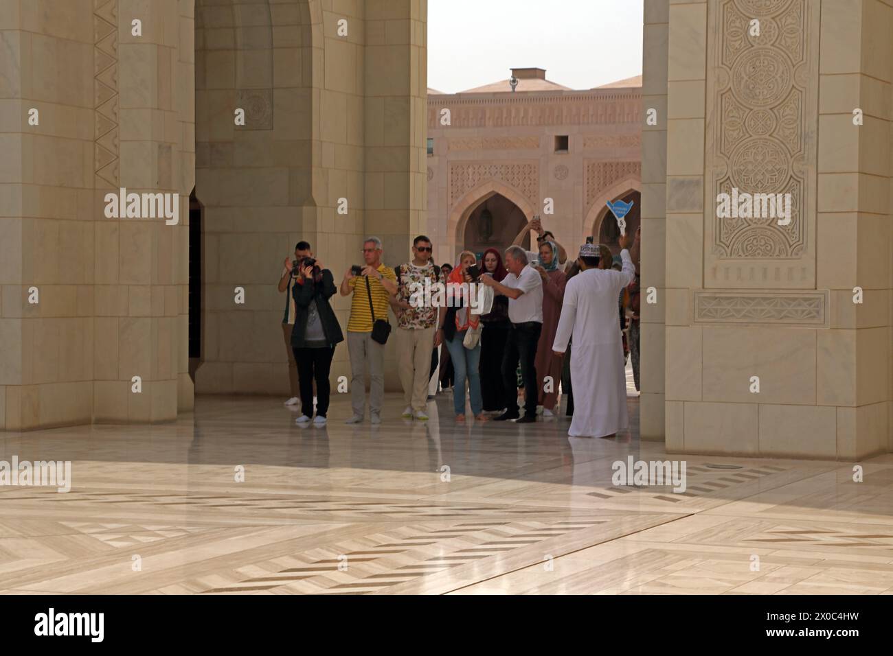 Tour Group Visiting Sultan Qaboos Grand Mosque Muscat Oman Stock Photo