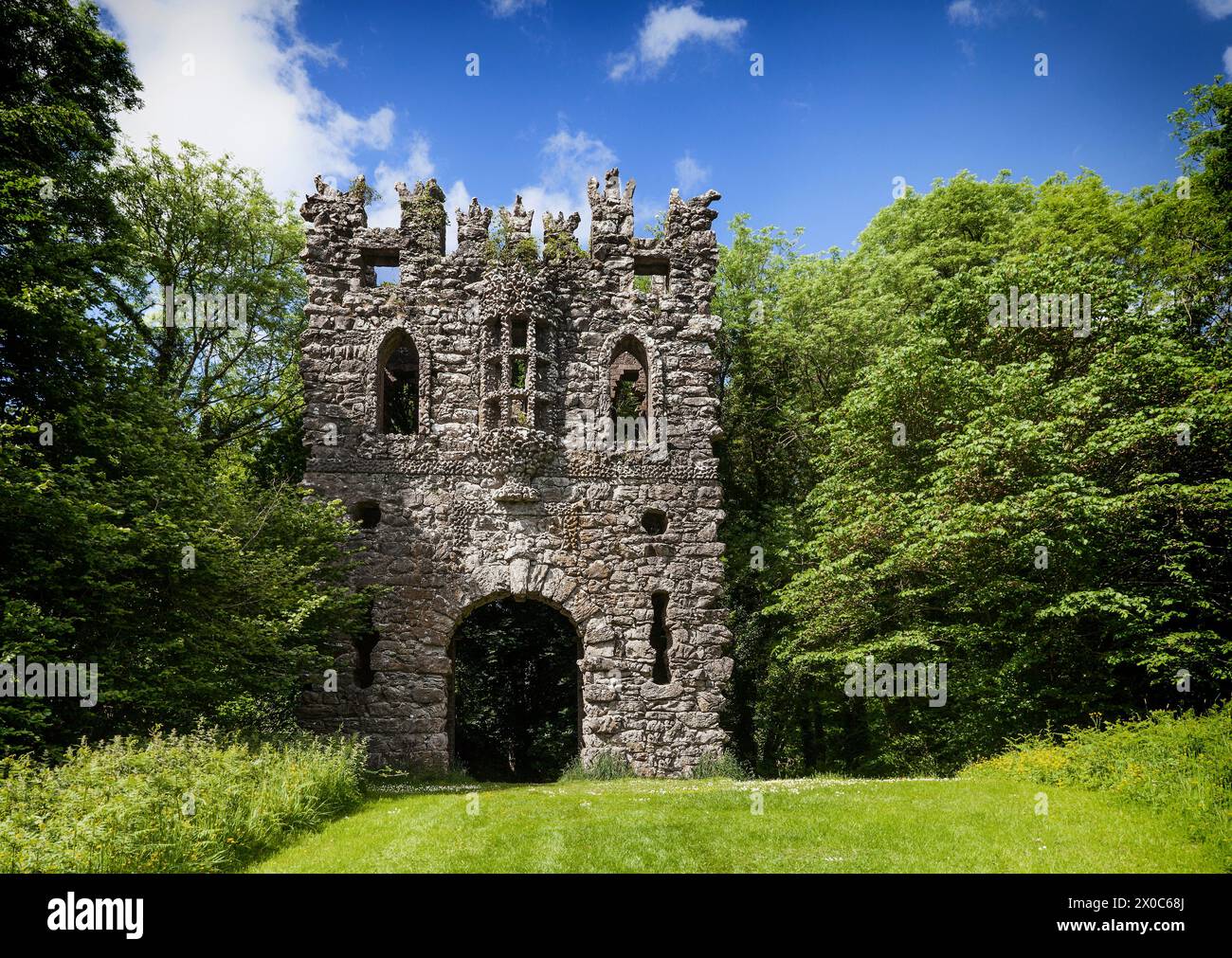 The rustic Gothic Arch mock entrance folly into the Belvedere demesne in County Westmeath, Ireland Stock Photo