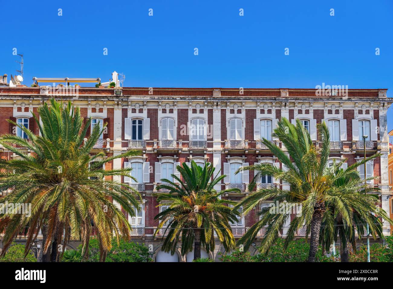 Cagliari waterfront historic buildings facade with wooden window ...