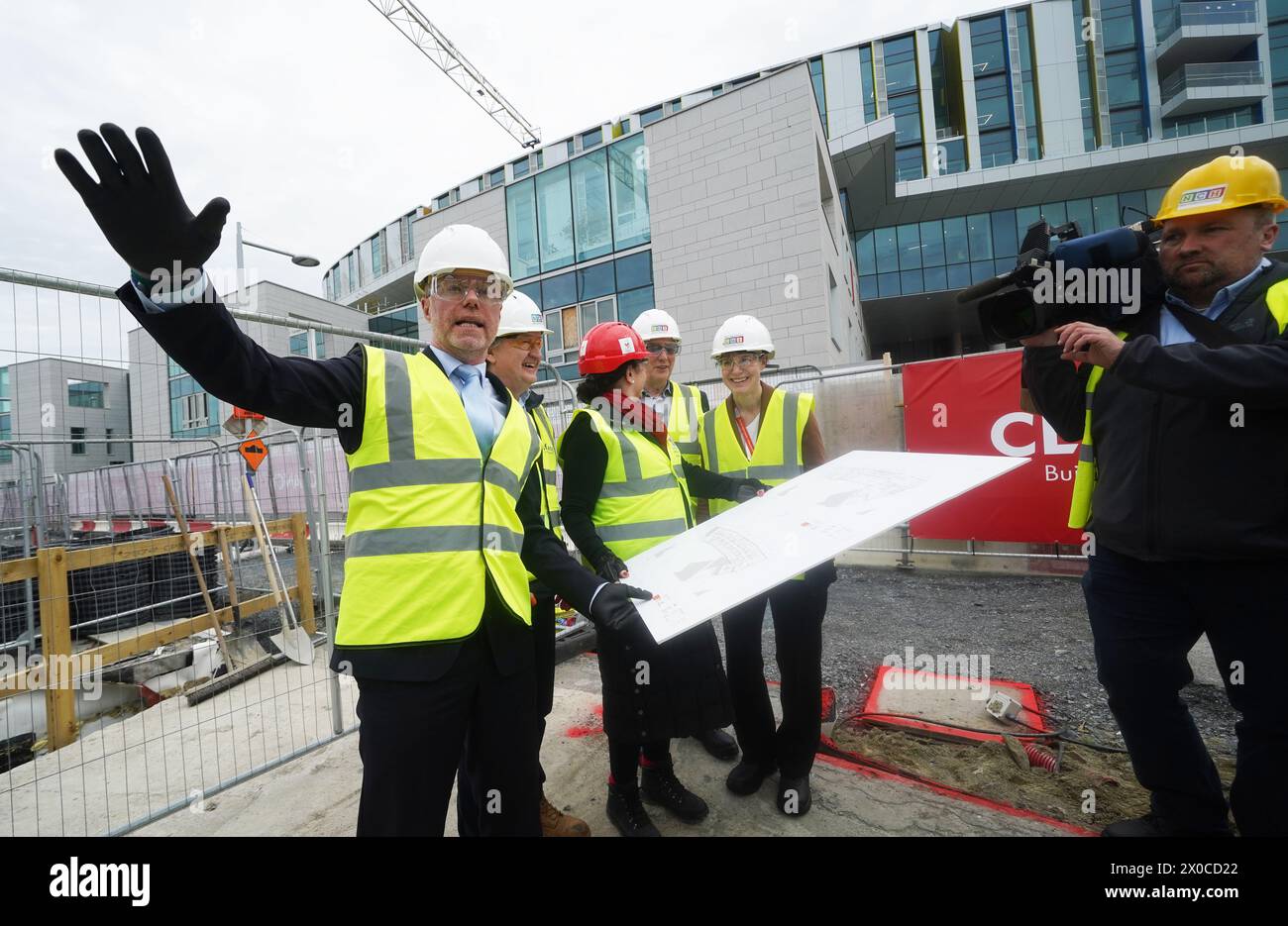 Minister for Health Stephen Donnelly (left) attends the sod turning to mark the commencement of construction at the site of the Ronald McDonald House, at the new children's hospital in Dublin. Picture date: Thursday April 11, 2024. Stock Photo