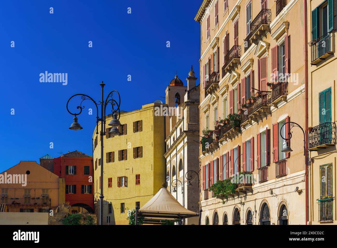 Cagliari historic colorful buildings facade with wooden window shutters ...