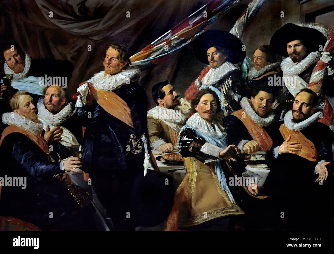 Banquet of the Officers of the St George Civic Guard (c.1627) Frans Hals, 1582-1666, Antwerp- Haarlem,  Dutch, The Netherlands,  17th century, Dutch Golden Age  ( He painted lively, sometimes even cheerful, portraits of people from all levels of society,  important people, naughty children and even drunks or people who had been declared crazy. ) Stock Photo