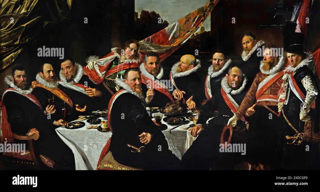 Banquet of the Officers of the St George Civic Guard 1616 by Frans Hals, 1582-1666, Antwerp- Haarlem,  Dutch, The Netherlands, 17th century, Dutch Golden Age (  St. George Civic Guard. They were a voluntary paramilitary force that both policed and protected the city of Haarlem in the Netherlands.  )  ( He painted lively, sometimes even cheerful, portraits of people from all levels of society,  important people, naughty children and even drunks or people who had been declared crazy. ) bANQUET OF THE oFFICERS OF THE ST gEORGE cIIVIC gUARD 1616 Stock Photo
