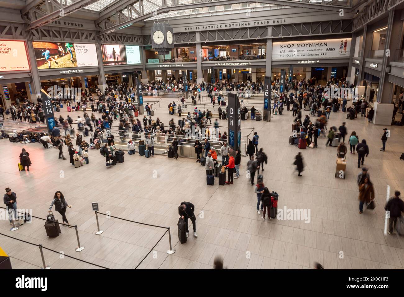 Amtrak service starts to resume as travelers crowd the Moynihan Train Hall at Penn Station in New York after the 4.8 magnitude earthquake that shook the Eastern seaboard on Friday morning, April 5, 2024. (© Richard B. Levine) Stock Photo