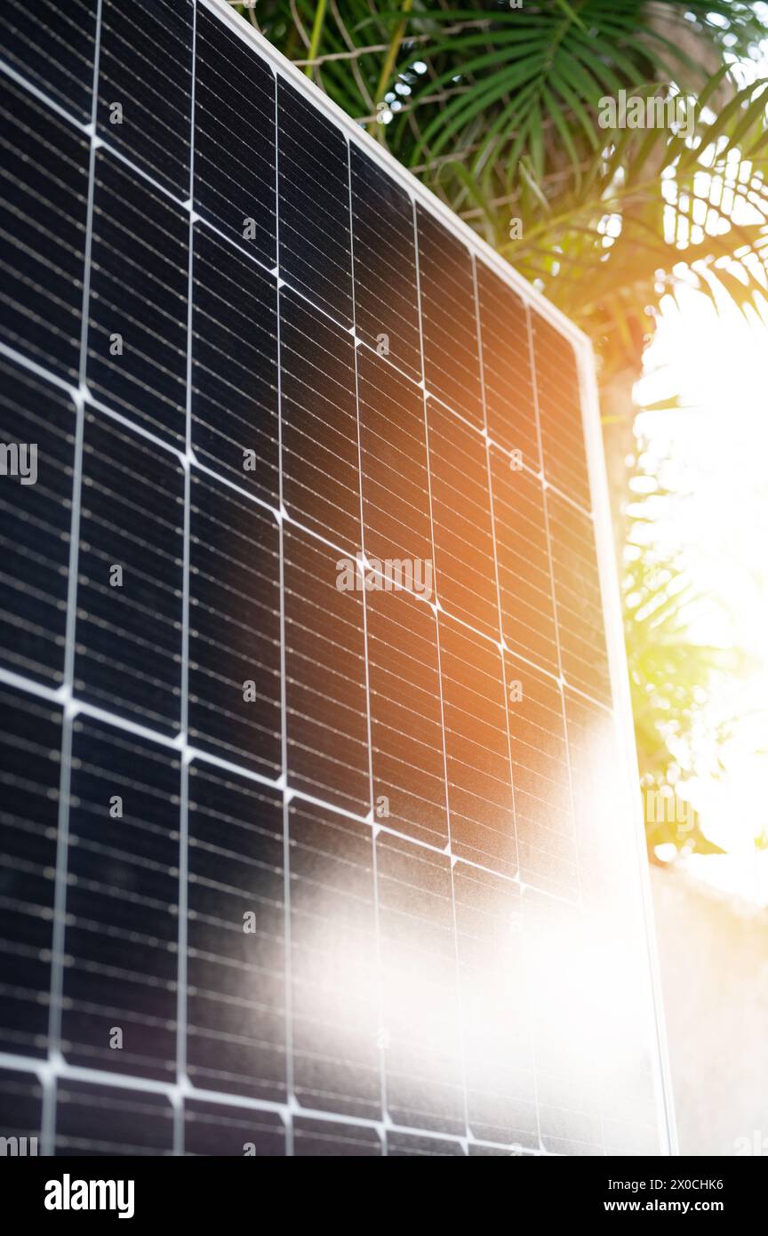 Using sun energy theme. Solar panel on bright tropical light background Stock Photo