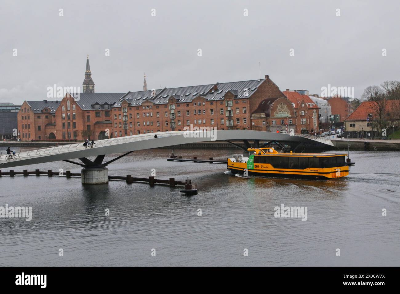 Yellow Boat bus passing under Lille Langebro bridge Copenhagen Denmark ...