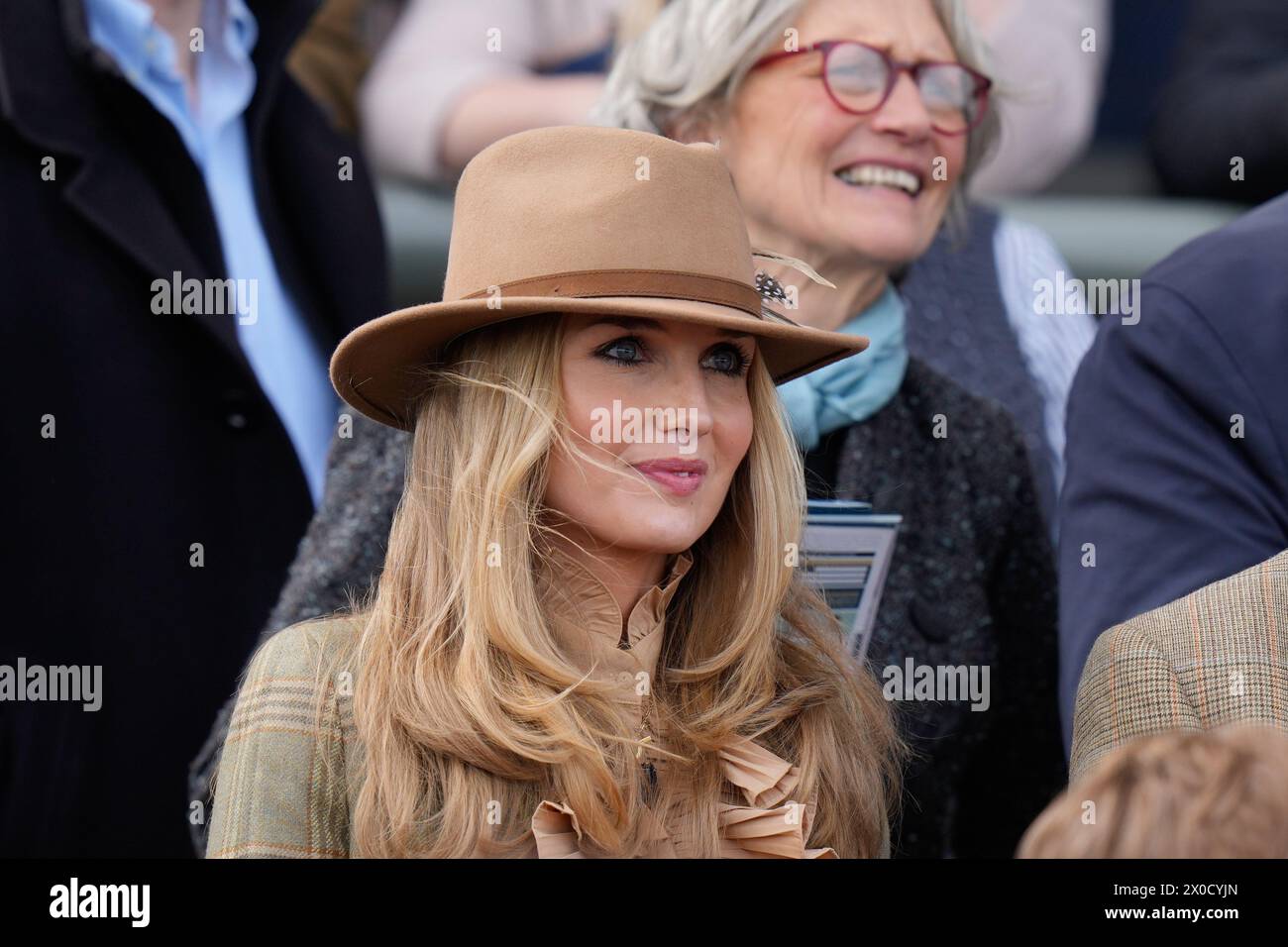 11th April 2024; Aintree Racecourse, Aintree, Merseyside, England: 2024 Grand National Festival Day 1; Ladies watch the racing from the stands Stock Photo