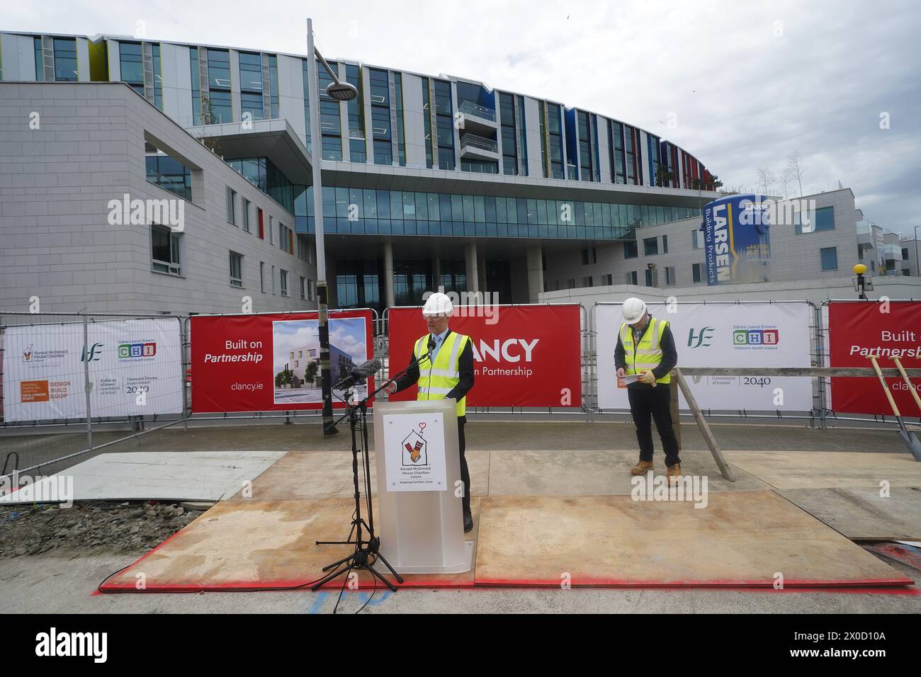 Minister for Health Stephen Donnelly (left) speaking at the sod turning to mark the commencement of construction at the site of the Ronald McDonald House, at the new children's hospital in Dublin. Picture date: Thursday April 11, 2024. Stock Photo