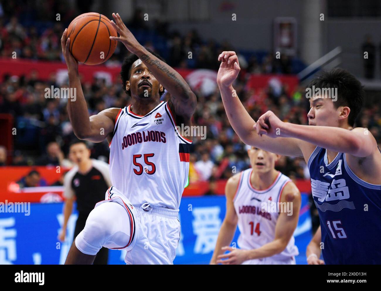 Qingdao, China's Shandong Province. 11th Apr, 2024. Barry Brown (L) of Guangdong Loong Lions goes for a lay-up during the play-off first leg match between Guangdong Loong Lions and Qingdao Eagles at the 2023-2024 season of the Chinese Basketball Association (CBA) league in Qingdao, east China's Shandong Province, April 11, 2024. Credit: Li Ziheng/Xinhua/Alamy Live News Stock Photo