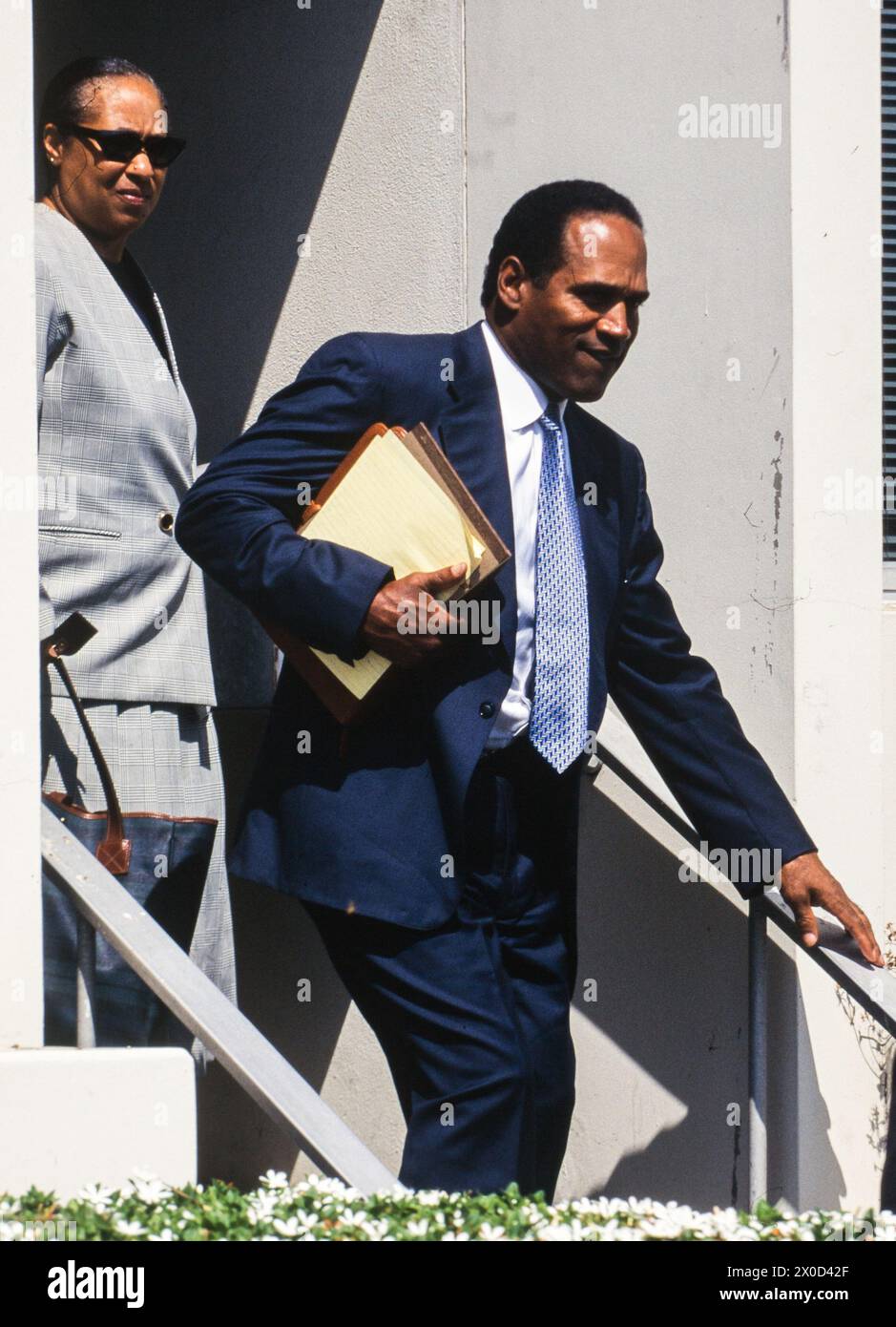 O.J. Simpson(R) leaves the Santa Monica, California Courthouse through a side entrance with unidentified members of his defense team on September 20, Stock Photo