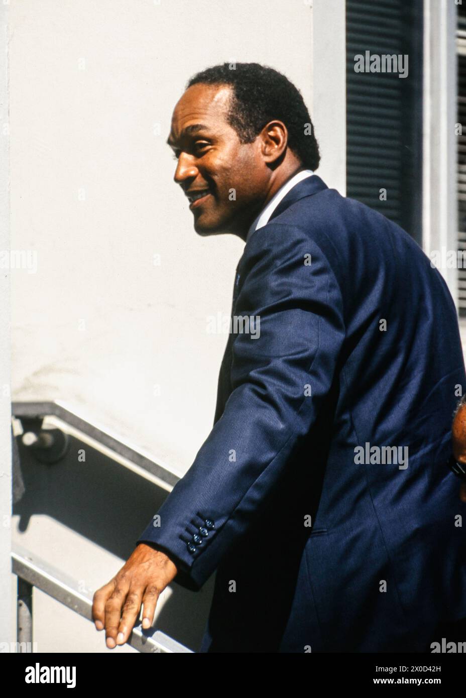 O.J. Simpson(L) leaves the Santa Monica, California Courthouse through a side entrance with unidentified members of his defense team on September 20, Stock Photo