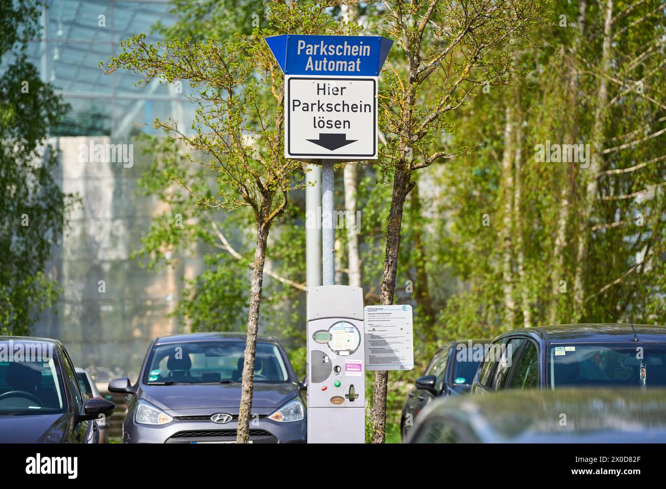 Garching, Bavaria, Germany 11 April 2024 Parking ticket machine in a parking lot. Sign Buy