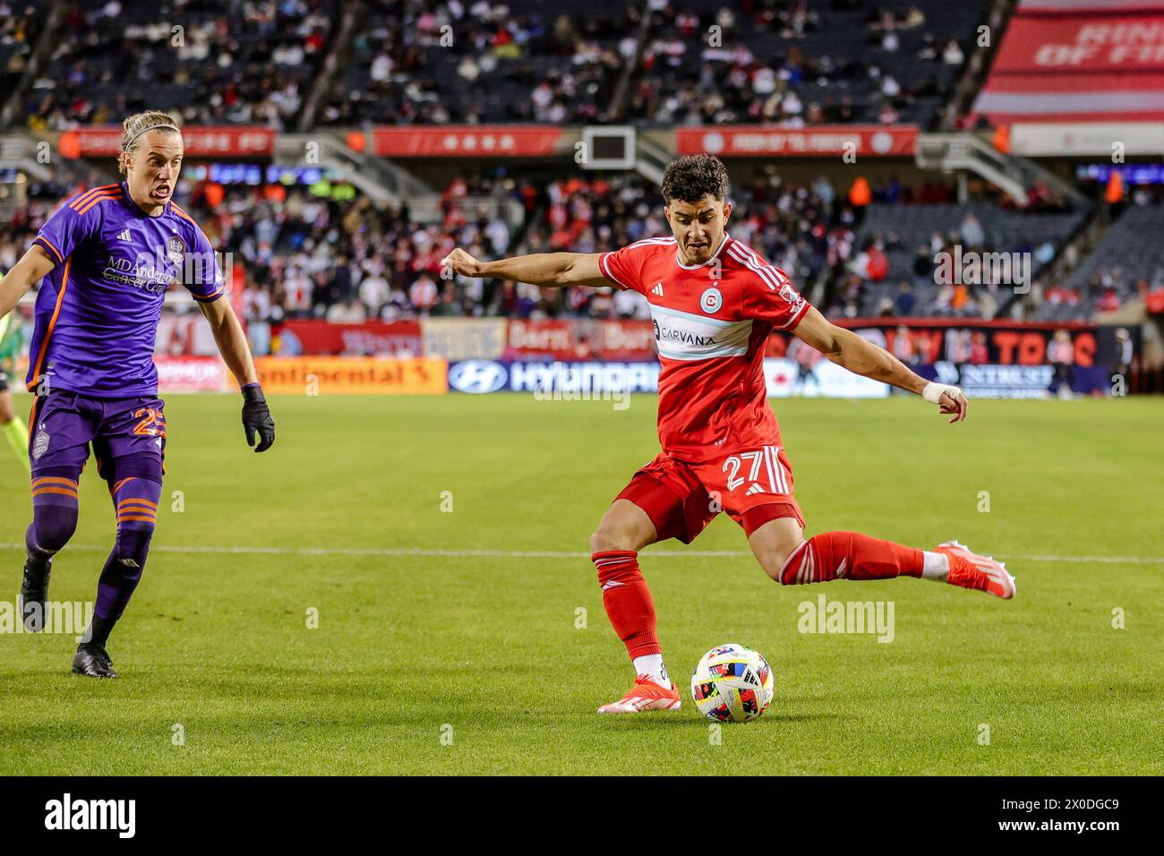 Allan Arigoni #27 of Chicago Fire FC performing a kick in Chicago, IL. Stock Photo