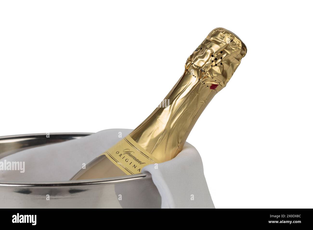 Bottle of champagne in bucket. Isolated over white background. Close-up. Stock Photo