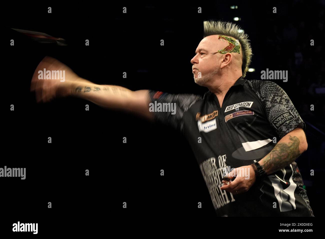 Peter Wright in action against Luke Humphries (Not pictured) on night