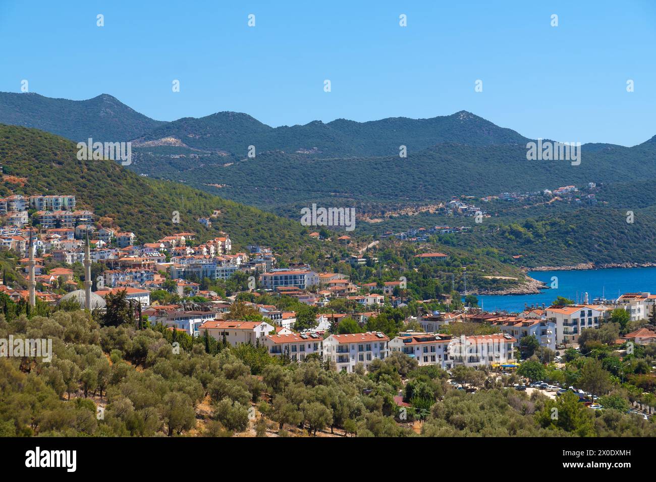 Beautiful view of the seaside resort town of Kas in Turkey. Villas and hotels with red roofs are open to tourists Stock Photo