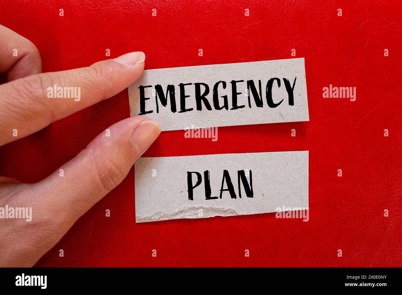 Emergency plan words written on paper pieces with red background. Conceptual symbol. Copy space. Stock Photo