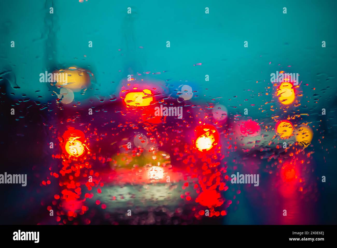 View through a car windscreen at night in traffic and heavy rain Stock Photo