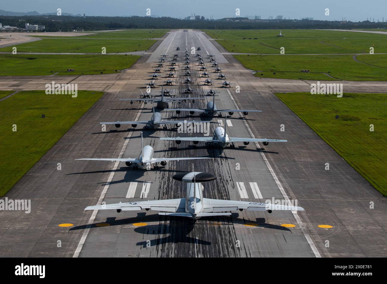 U.S. Air Force and Navy aircraft line up on the runway during an elephant walk at Kadena Air Base, Japan, Apr. 10, 2024. Stock Photo