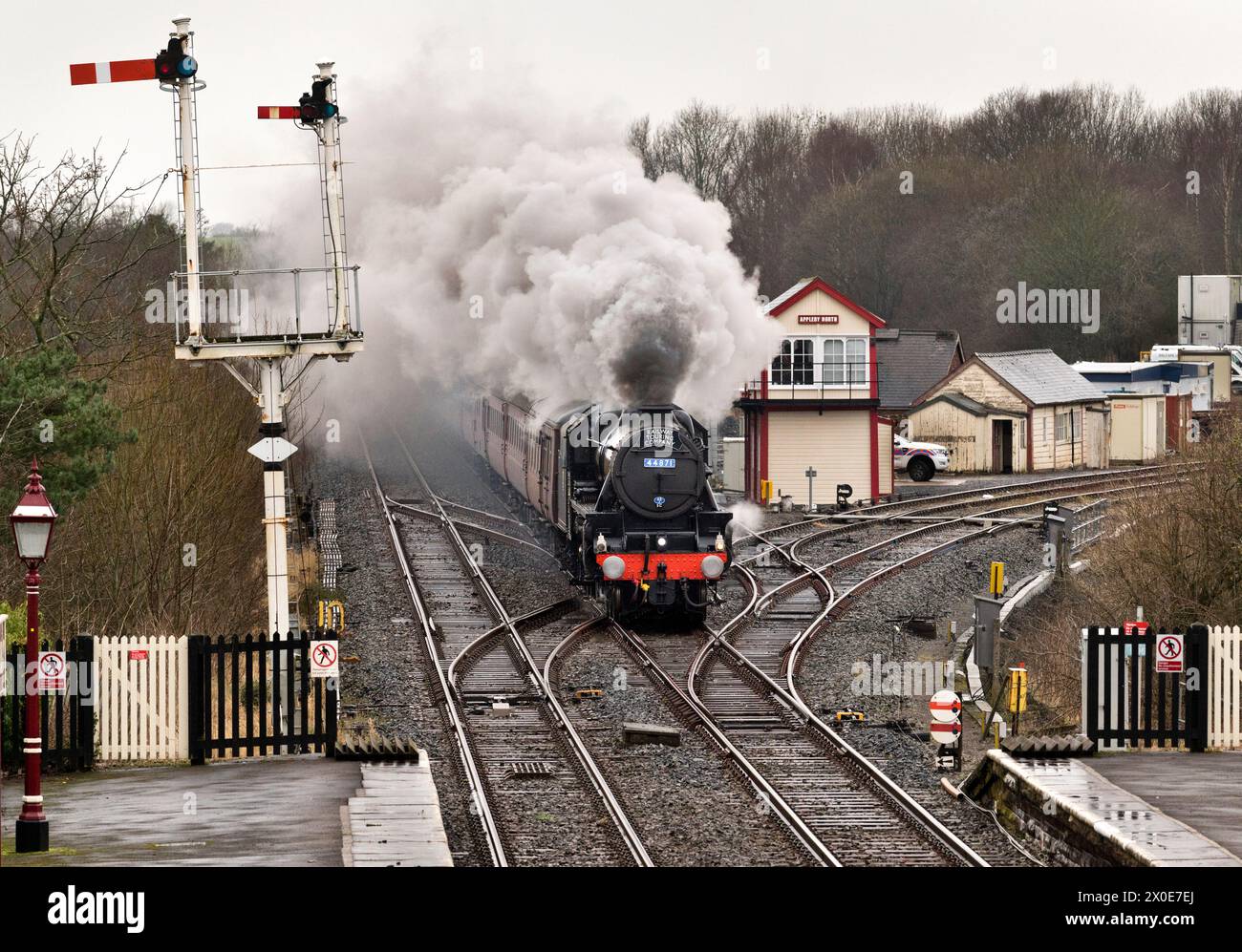 A Black Five steam locomotive hauls the Cumbrian Mountain Express special through Appleby Station on the Settle-Carlisle railway line Stock Photo
