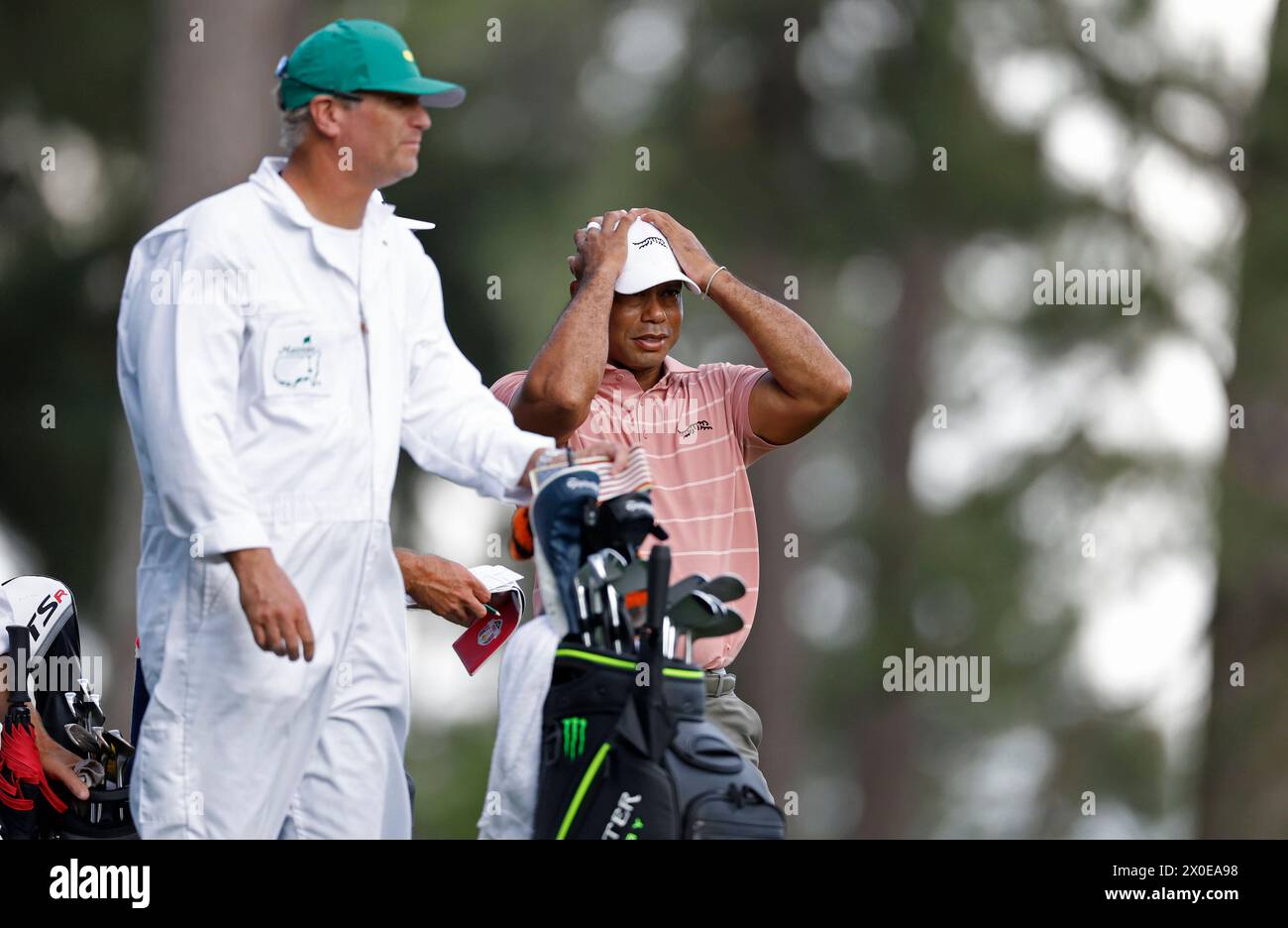 Augusta, United States. 11th Apr, 2024. Tiger Woods prepares to tee off