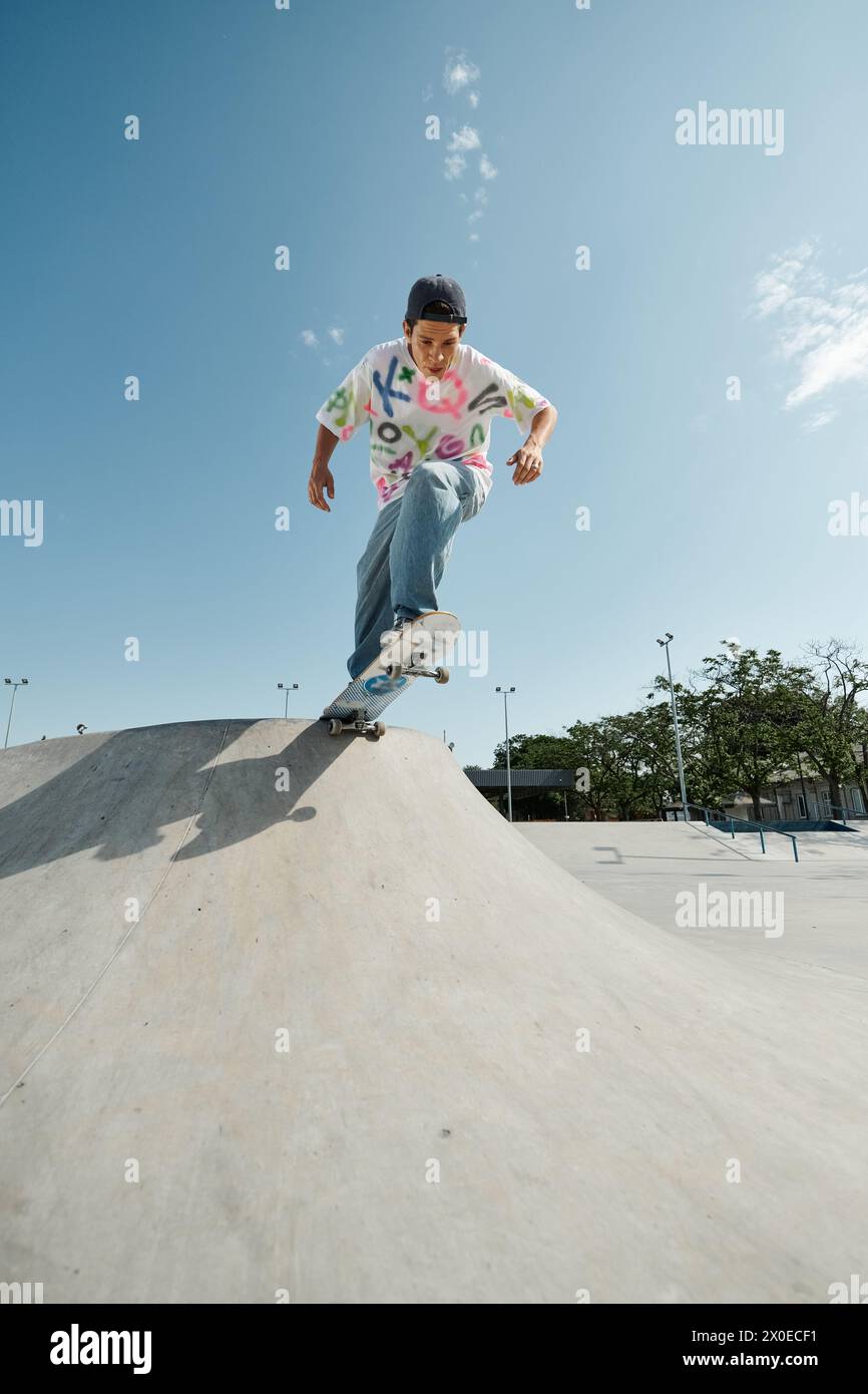 Boys Ramp Young skater boy rides skateboard down side of outdoor ramp in summer ...