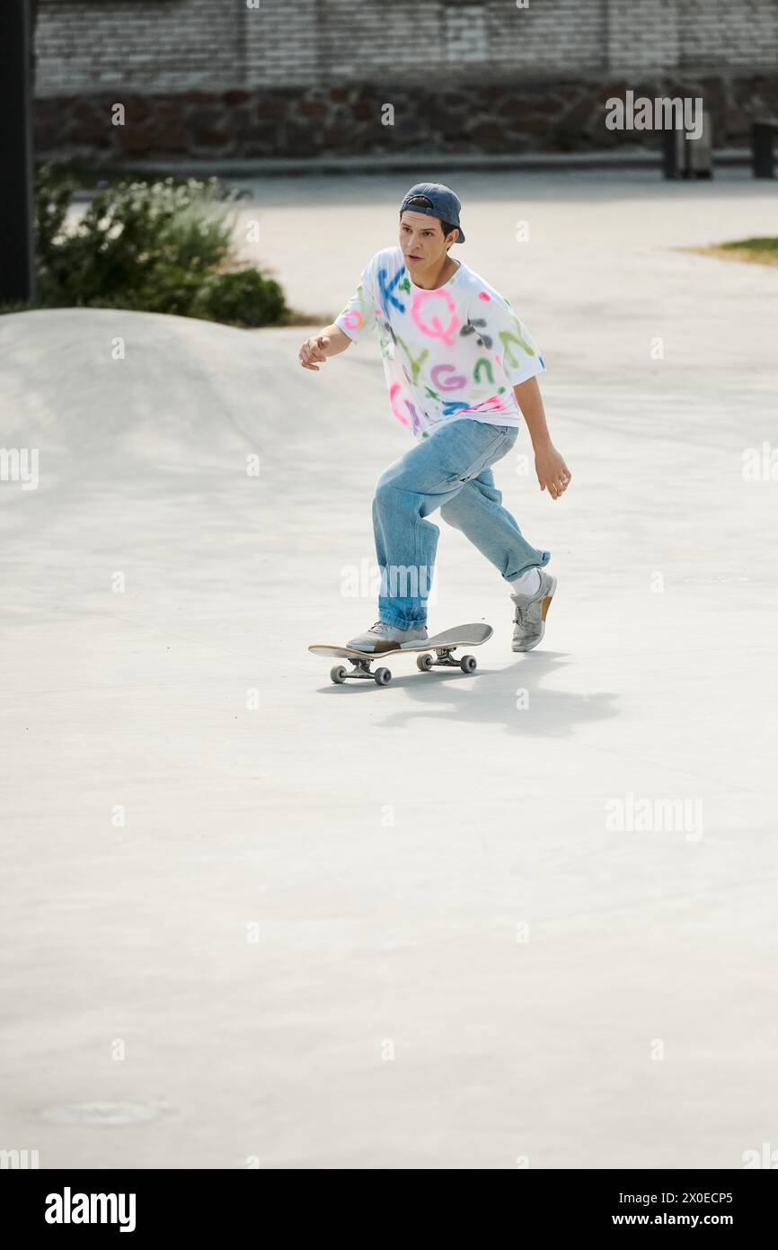 A young skater boy confidently rides his skateboard down a cement ramp ...